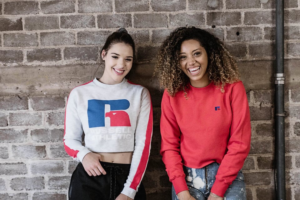 Women wearing Russell Athletic sweatshirts.