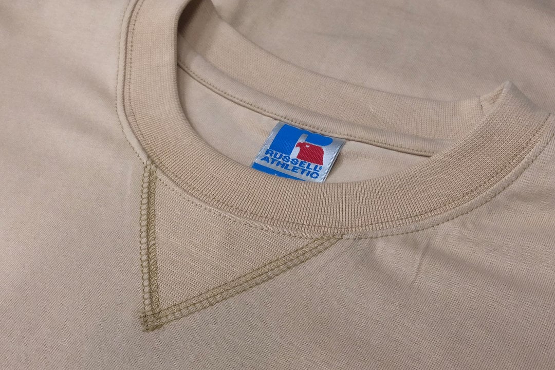 Closeup picture of Russell Athletic hoodie showing the v-notch design.