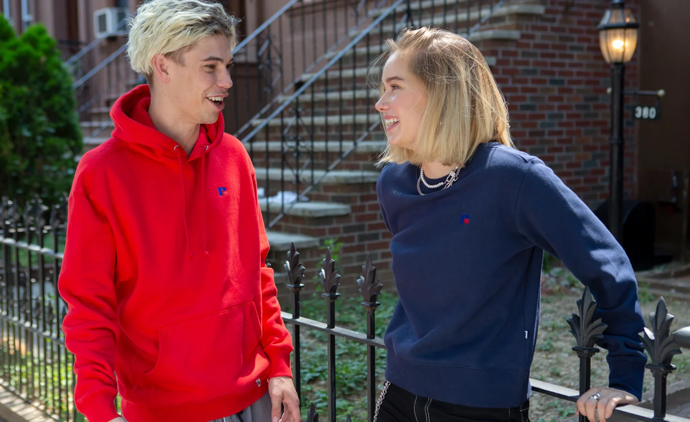 Man and Woman wearing Russell Athletic clothing.